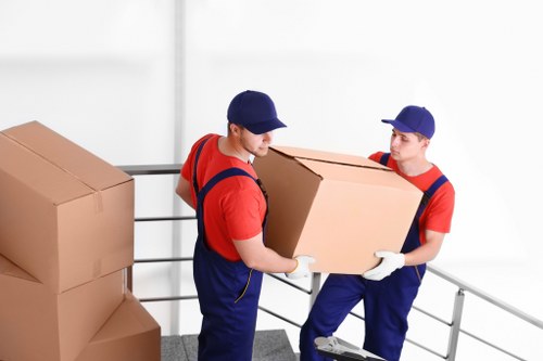 Same day removals team handling boxes in Camden street