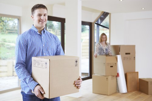 Professional flat removals in Camden with moving van and packed boxes