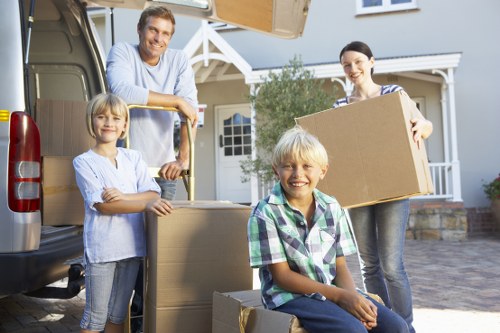 Removals team handling furniture during a Camden home move