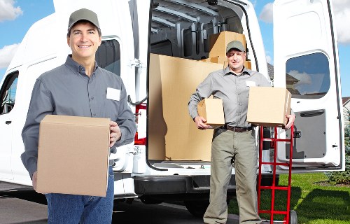 Professional movers packing household items for a Camden relocation