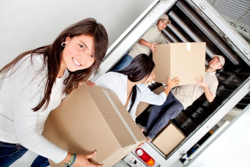 A well-organised flat removal day in Camden with boxes and movers