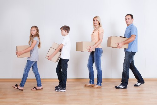 Packed moving boxes and furniture prepared by Camden movers