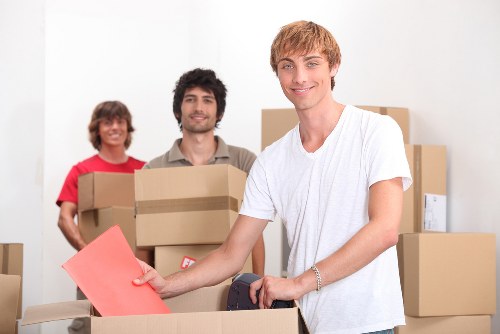 Boxes and furniture arranged for a load-based Camden removals estimate